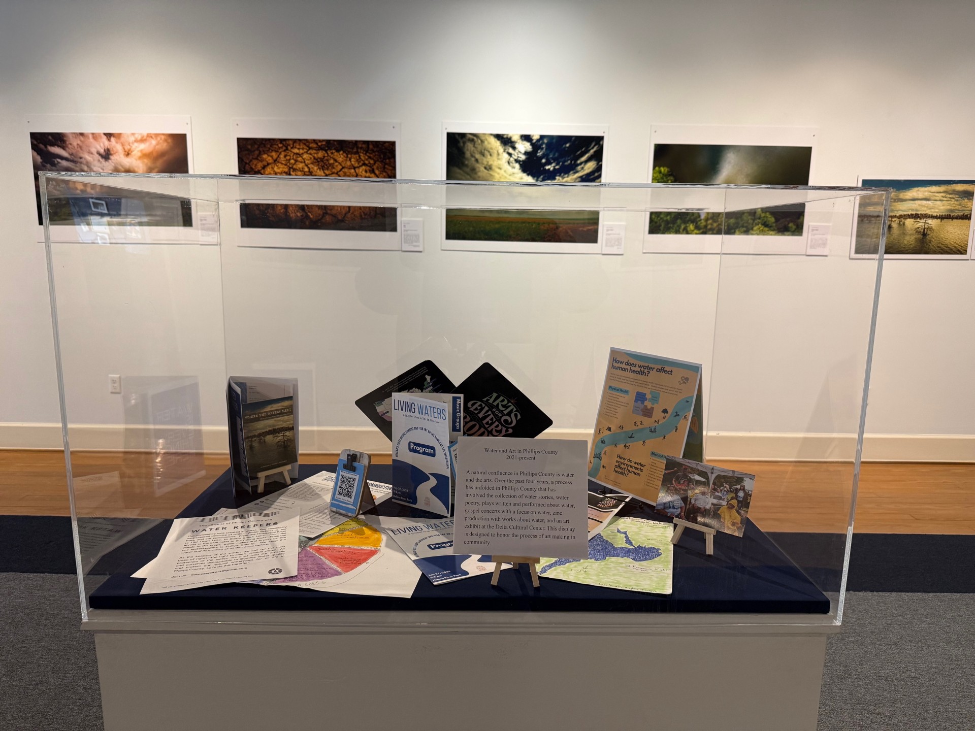 A collection of zines, poetry, drawings, pictures, and writing in a light box for the 